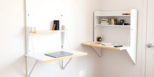 Wall-mounted foldable desk in a small student apartment